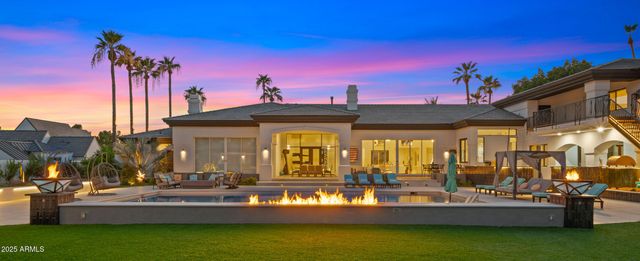 a front view of a house with garden and porch