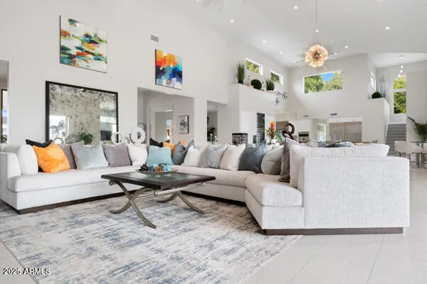 a living room with furniture and a potted plant
