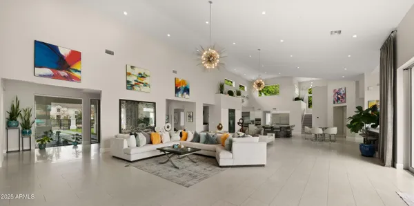 a dining room with furniture and wooden floor