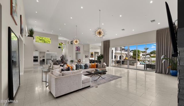 a bedroom with a bed and a flat tv screen next to a window