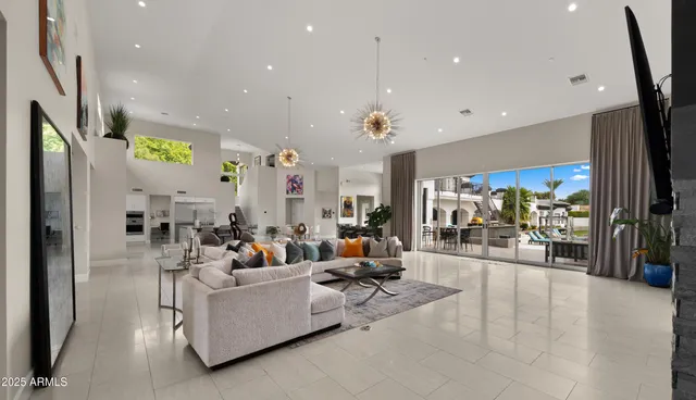 a bedroom with a bed and a flat tv screen next to a window