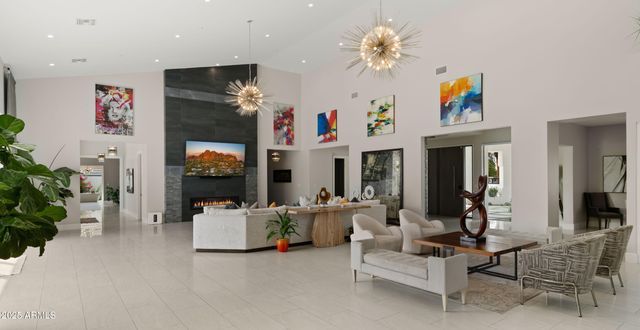 a room with gym equipment and wooden floor