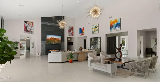 a room with gym equipment and wooden floor