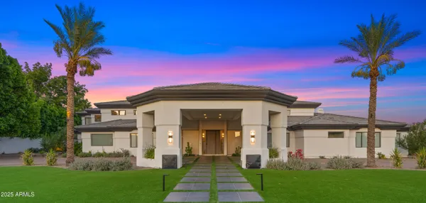 a potted plant sitting on a brick wall with a potted plant
