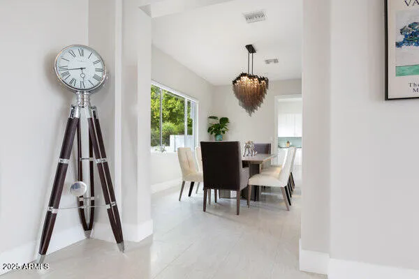 an aerial view of a house with a garden and swimming pool