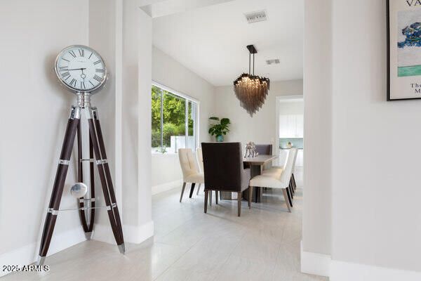an aerial view of a house with a garden and swimming pool