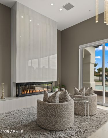 a view of a swimming pool with a lounge chair and floor to ceiling fan