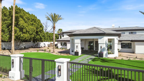 4425 North Arcadia Lane Phoenix, AZ 85018 - Photo 5 of 138 a front view of a house with garden and porch