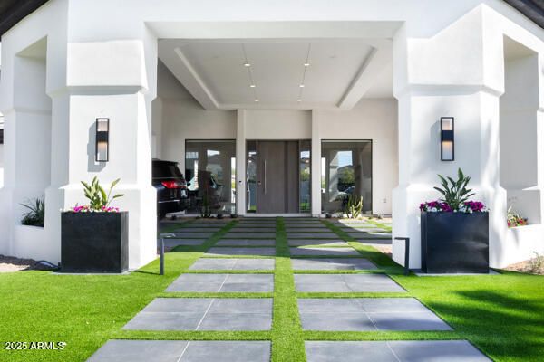 a kitchen with stainless steel appliances a stove a sink and a microwave