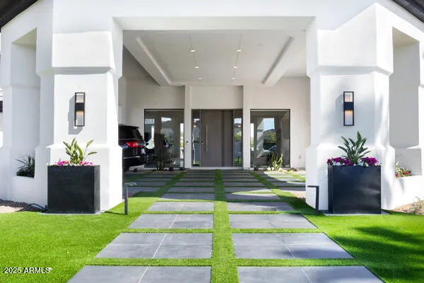 a kitchen with stainless steel appliances a stove a sink and a microwave