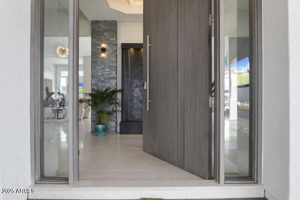 a kitchen with granite countertop a table chairs stove and a sink