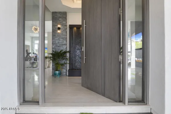 a kitchen with granite countertop a table chairs stove and a sink