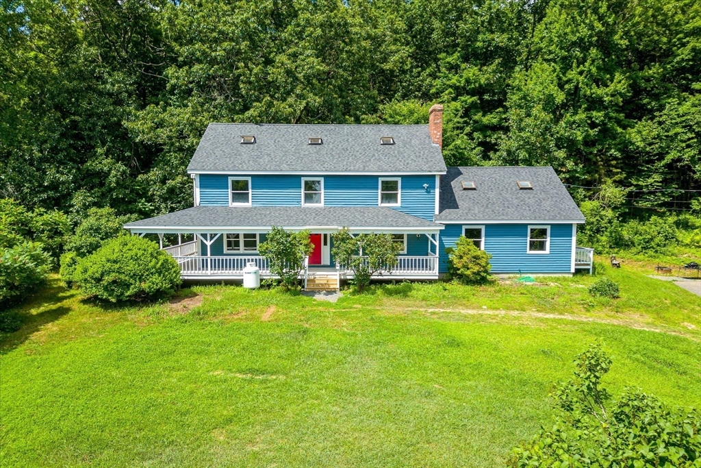 168 O'Neil Road West Warren, MA 01092 - Photo 1 of 42 front view of a house with a yard