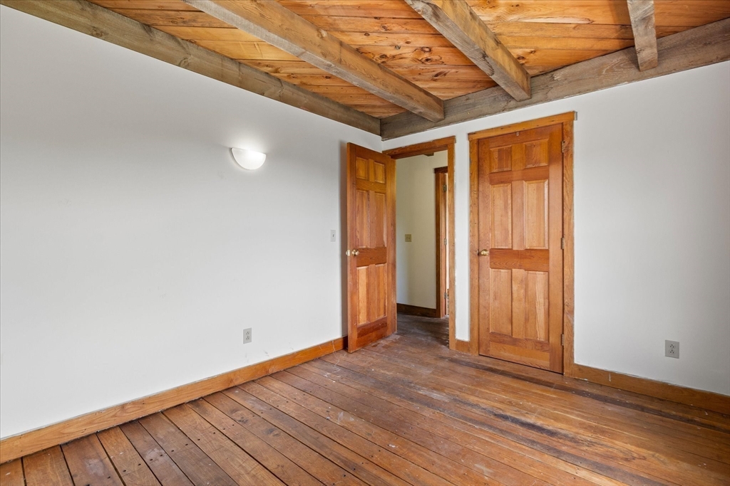 168 O'Neil Road West Warren, MA 01092 - Photo 20 of 42 a view of an empty room with wooden floor and a window