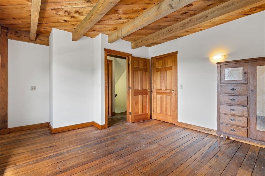 168 O'Neil Road West Warren, MA 01092 - Photo 22 of 42 a view of an empty room with wooden floor