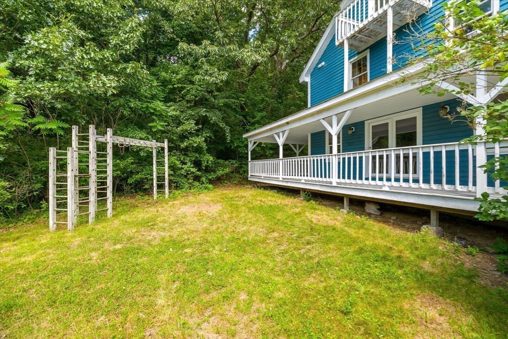 168 O'Neil Road West Warren, MA 01092 - Photo 41 of 42 a view of a swimming pool with a garden