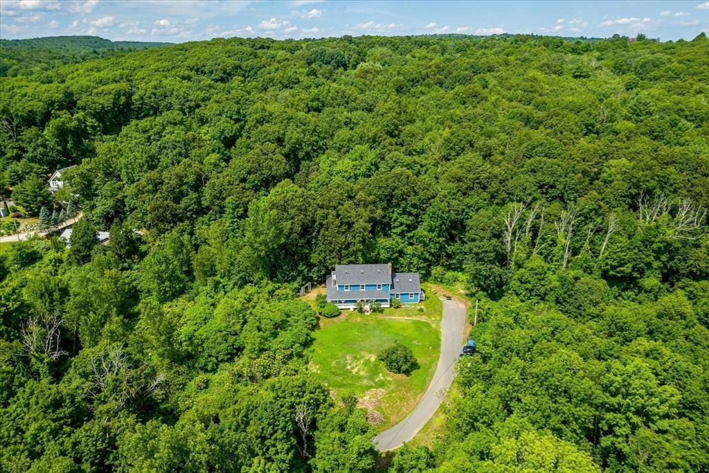 168 O'Neil Road West Warren, MA 01092 - Photo 42 of 42 a aerial view of a house with a yard