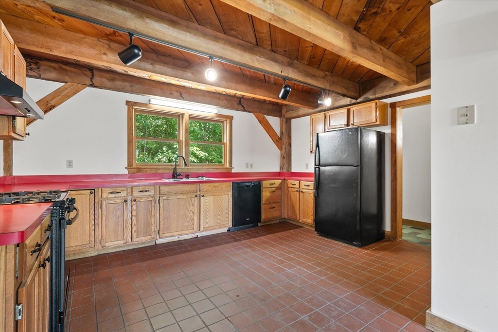 168 O'Neil Road West Warren, MA 01092 - Photo 8 of 42 a kitchen with stainless steel appliances kitchen island granite countertop a refrigerator and a sink