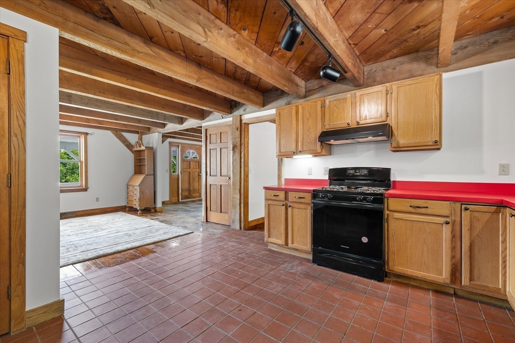 168 O'Neil Road West Warren, MA 01092 - Photo 9 of 42 a kitchen with a stove and a refrigerator