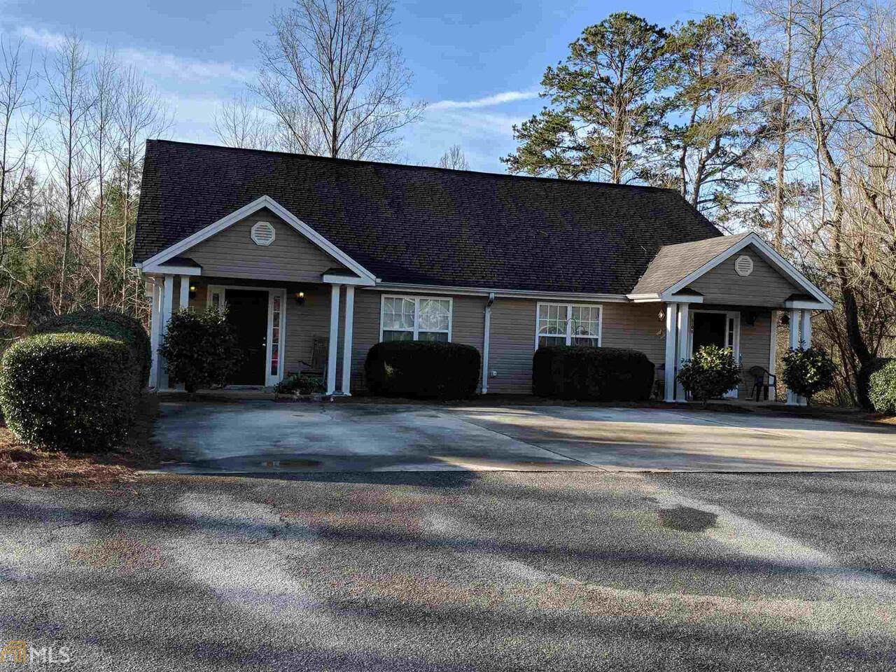 808 Cap Fry Road, Unit 1 Demorest, GA 30535 - Photo 1 of 1 a front view of a house with a garden
