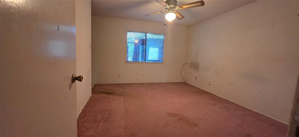 1323 Timberview Drive Allen, TX 75002 - Photo 8 of 14 Carpeted room featuring a ceiling fan with integrated lighting and a window