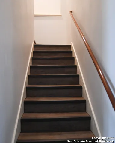 an empty room with wooden floor