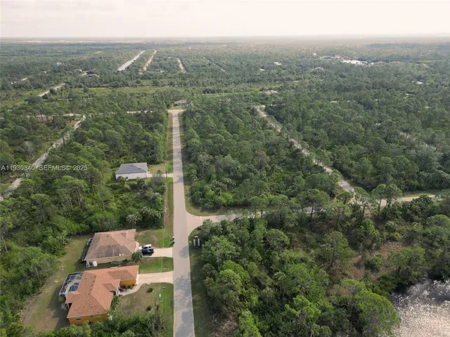 an aerial view of house with yard