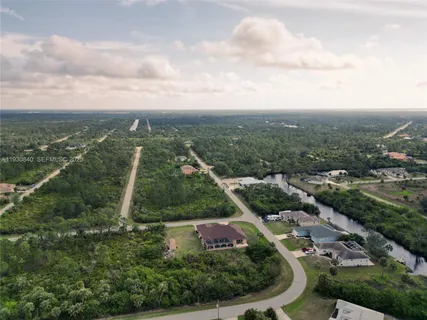 an aerial view of residential houses with outdoor space and garden