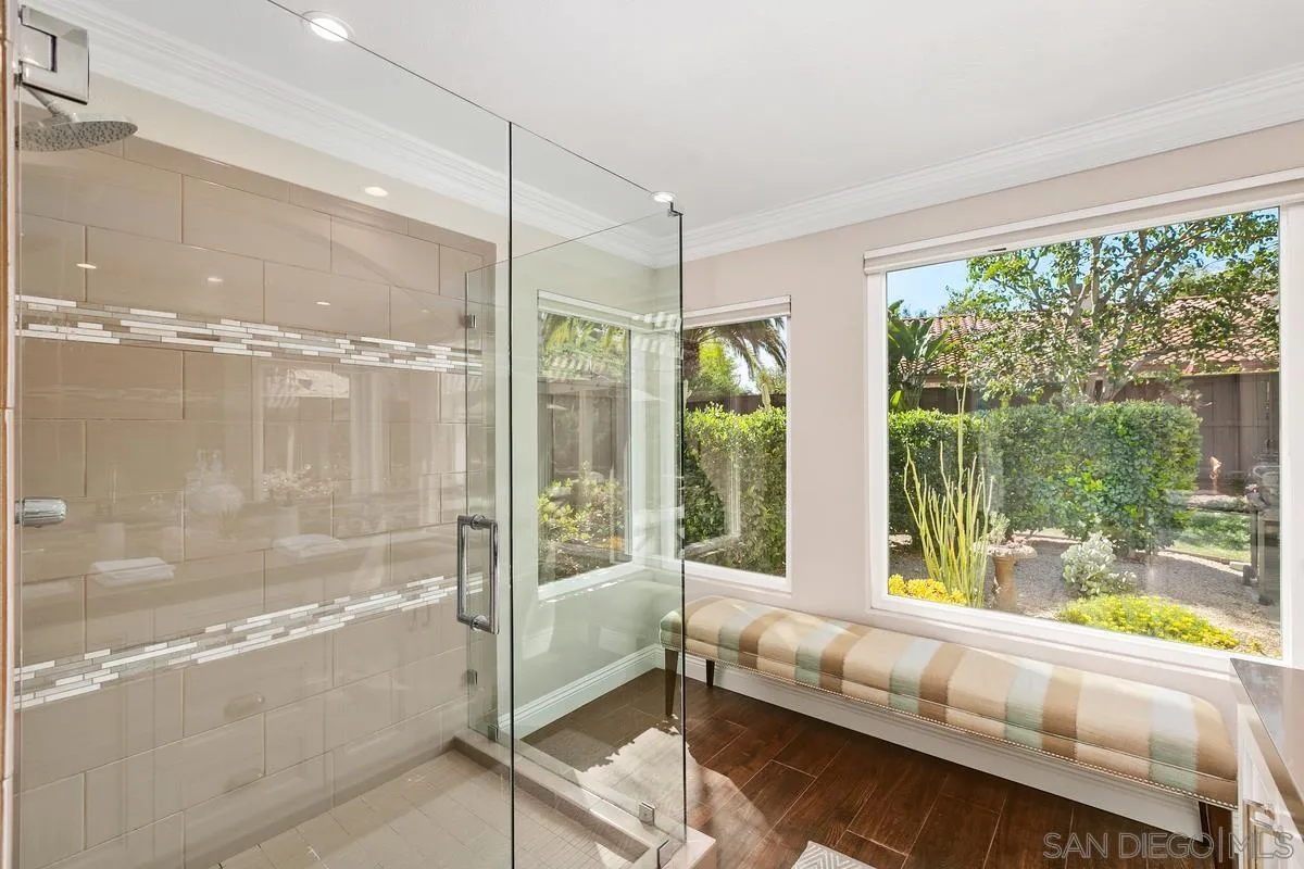 3330 Vista Rocosa Escondido, CA 92029 - Photo 15 of 29 a bathroom with a glass shower door and a large window