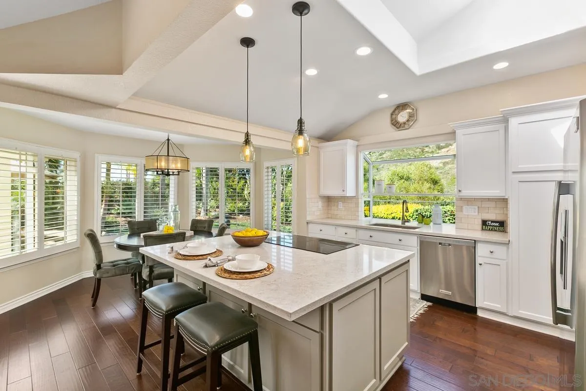 3330 Vista Rocosa Escondido, CA 92029 - Photo 10 of 29 a open dining room with stainless steel appliances granite countertop a stove and kitchen island