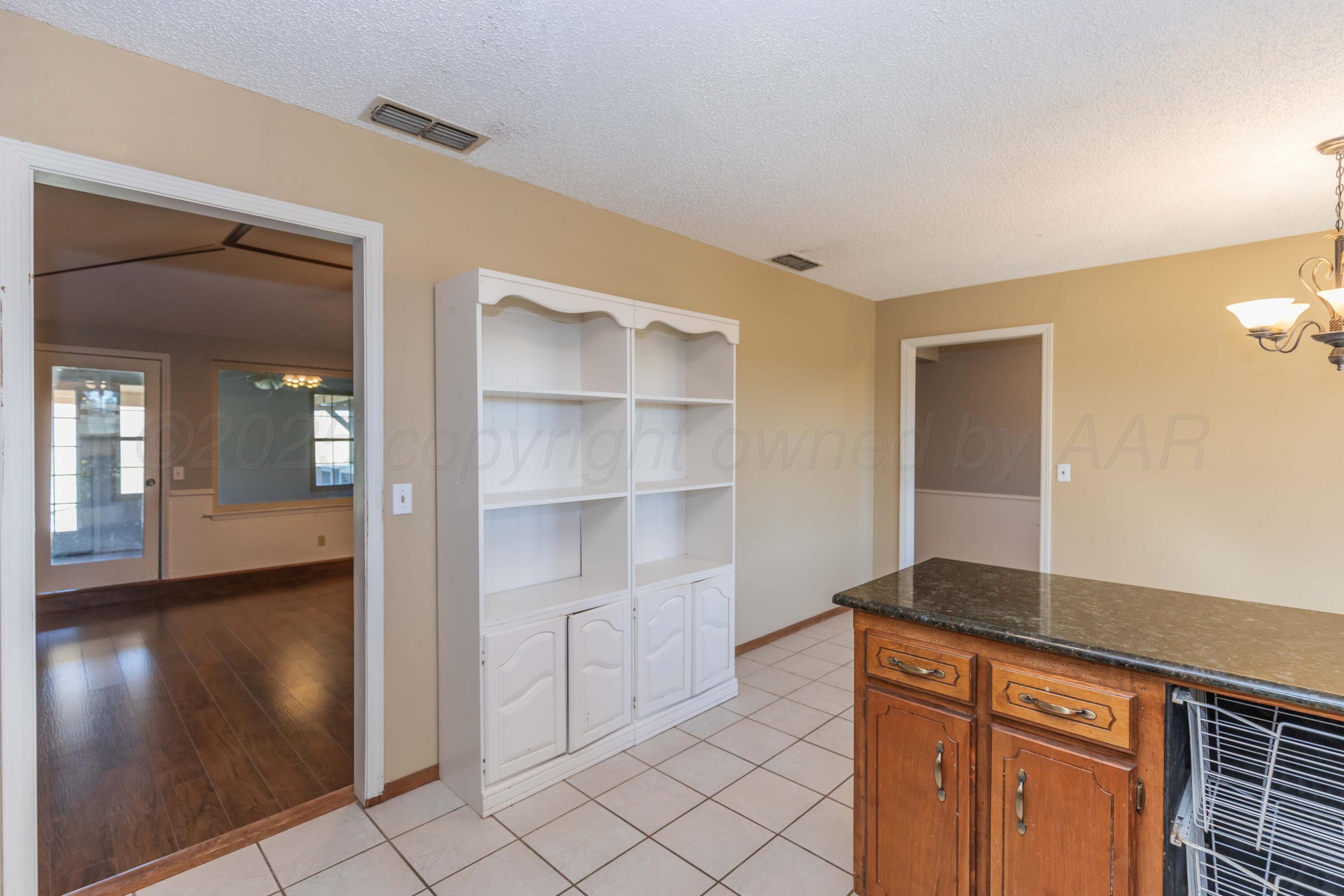 134 Eddie Street Canadian, TX 79014 - Photo 13 of 45 a hallway with cabinets