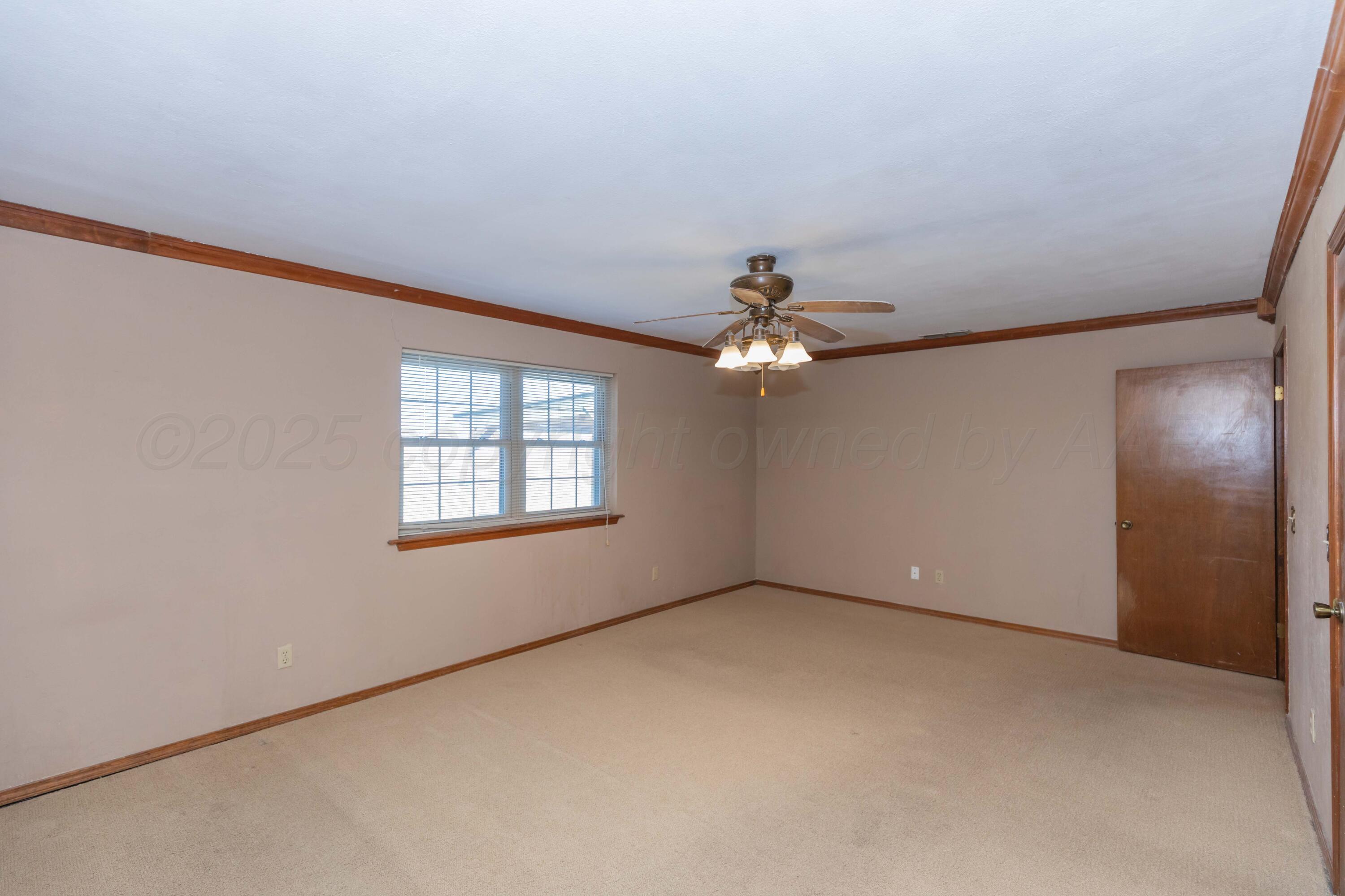 134 Eddie Street Canadian, TX 79014 - Photo 20 of 45 a view of an empty room with a window