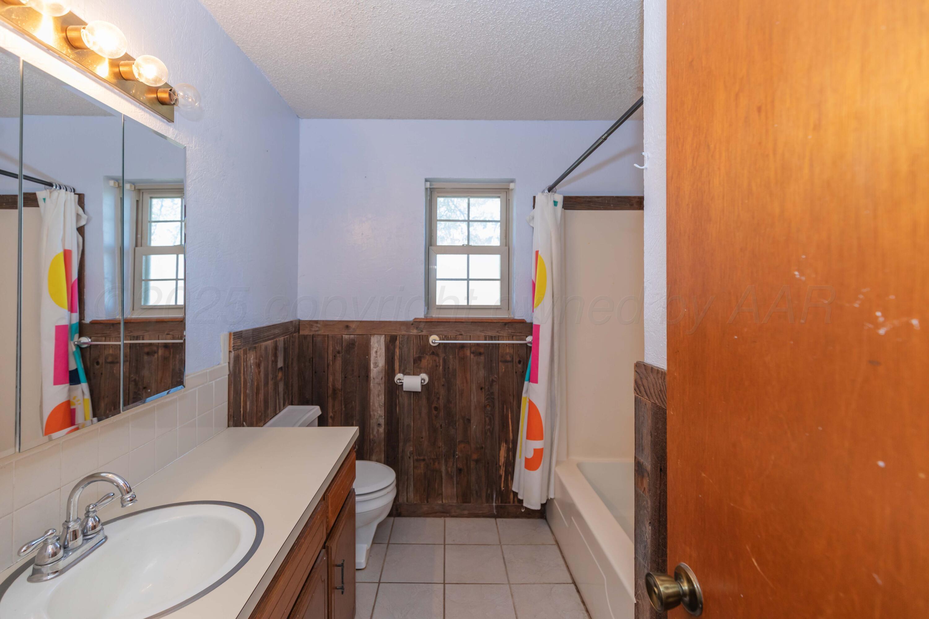 134 Eddie Street Canadian, TX 79014 - Photo 26 of 45 a room with a sink and a mirror