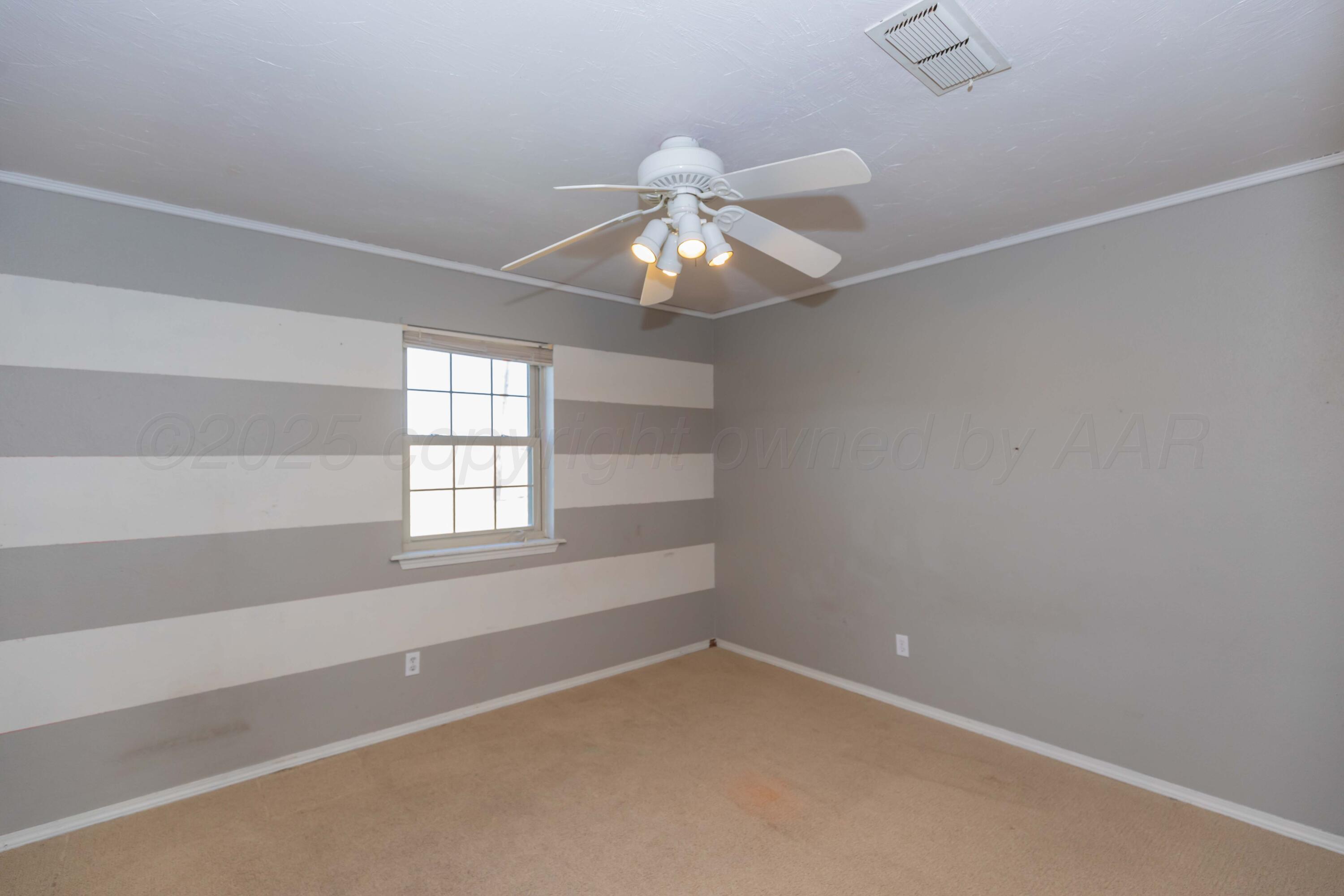 134 Eddie Street Canadian, TX 79014 - Photo 29 of 45 en empty room with a window