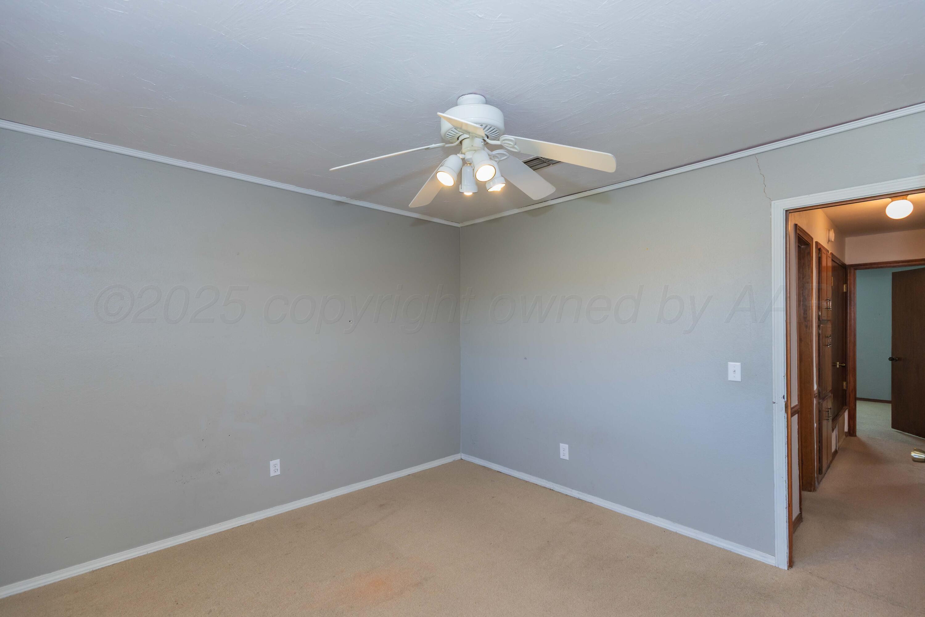 134 Eddie Street Canadian, TX 79014 - Photo 30 of 45 en empty room with a fan