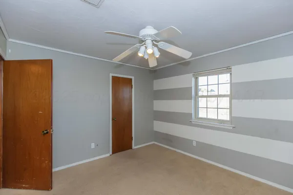 a view of empty room with windows