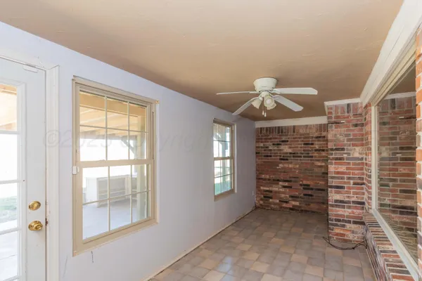 a view of a hallway with windows