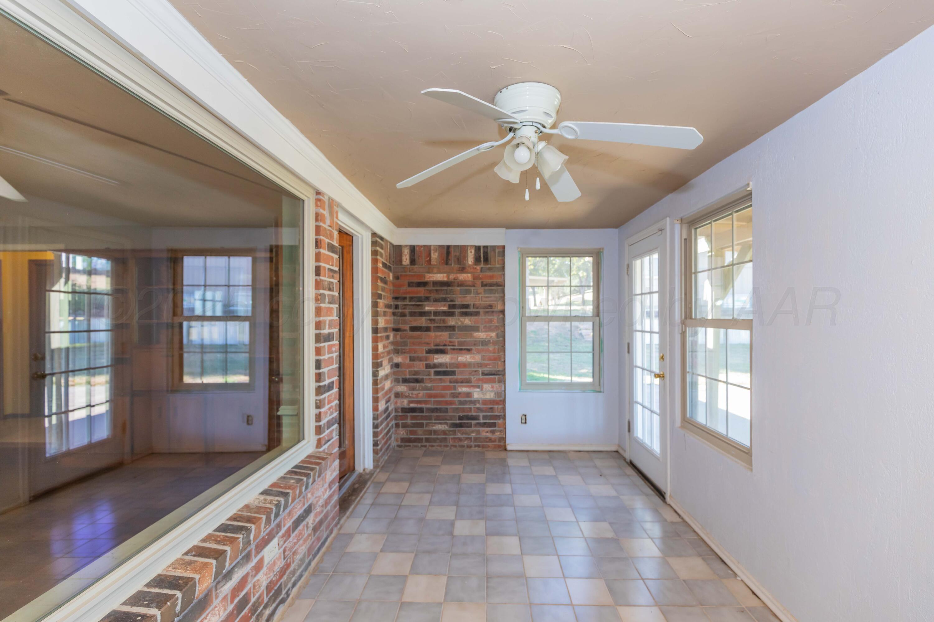 134 Eddie Street Canadian, TX 79014 - Photo 35 of 45 a view of an empty room with a window and wooden floor