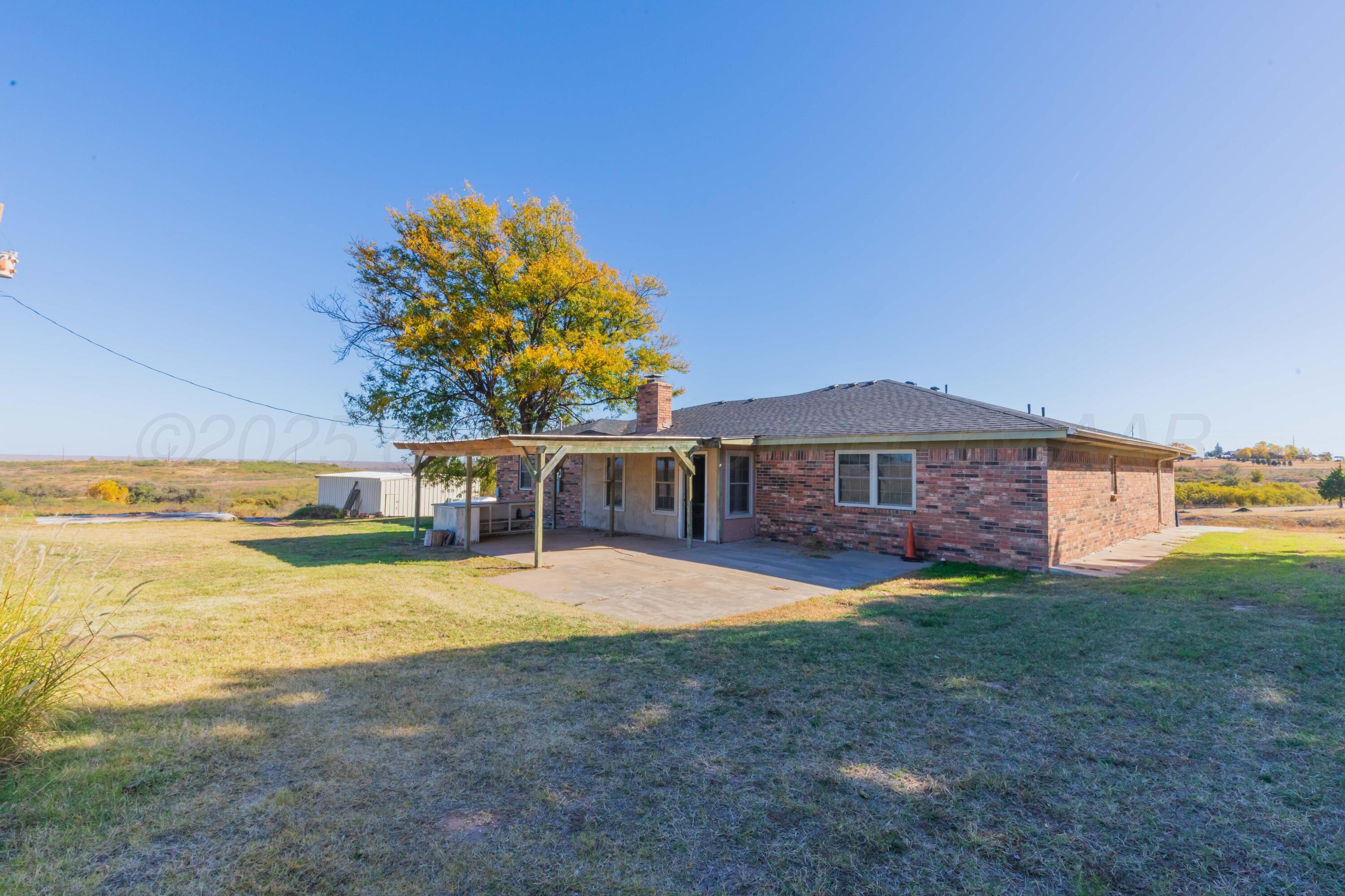 134 Eddie Street Canadian, TX 79014 - Photo 40 of 45 a view of a house with a yard and a large tree