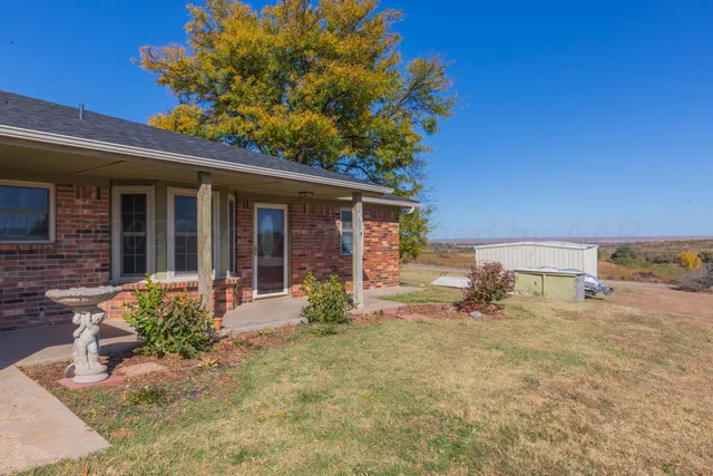 a backyard of a house with seating space