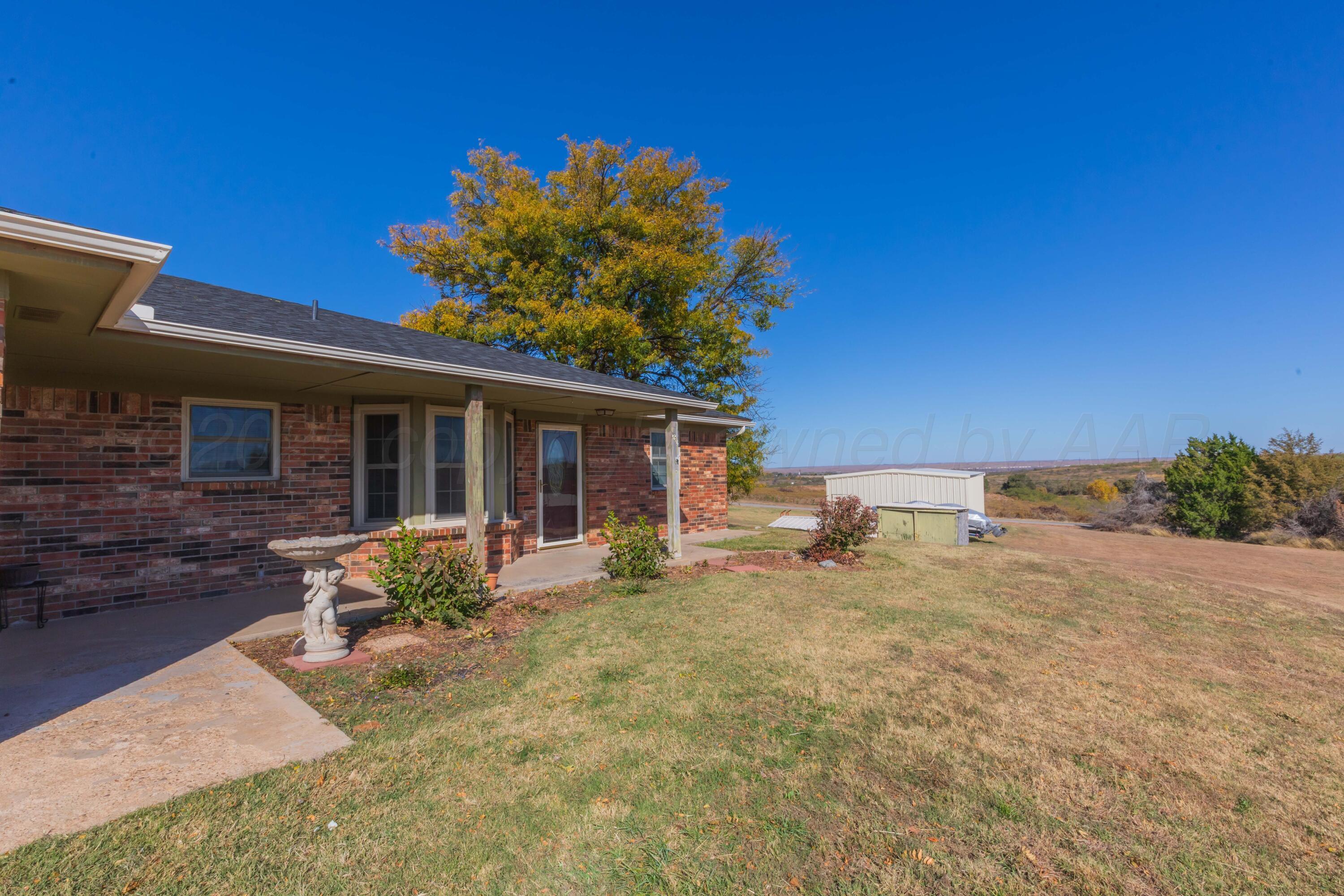134 Eddie Street Canadian, TX 79014 - Photo 5 of 45 a backyard of a house with seating space