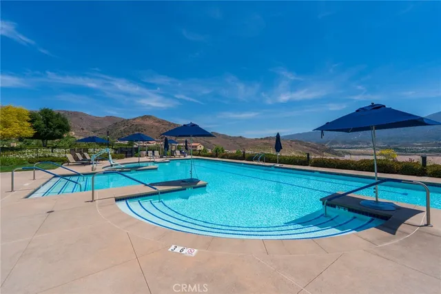 a view of swimming pool with seating area