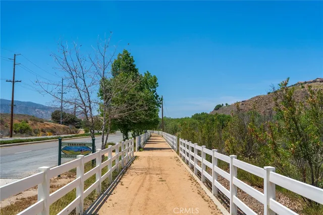 a view of swimming pool with a bench in patio