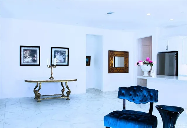 a living room with furniture a window and a mirror