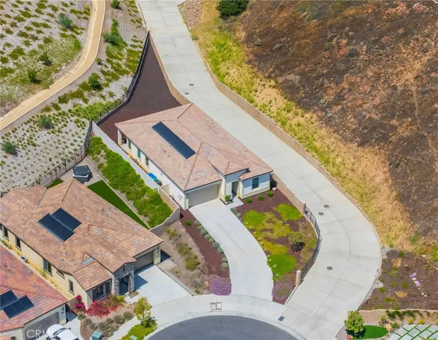 an aerial view of a house with a swimming pool