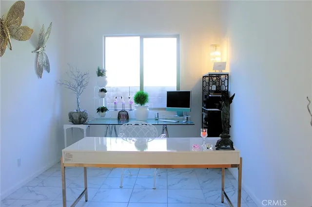 a view of hall way with furniture