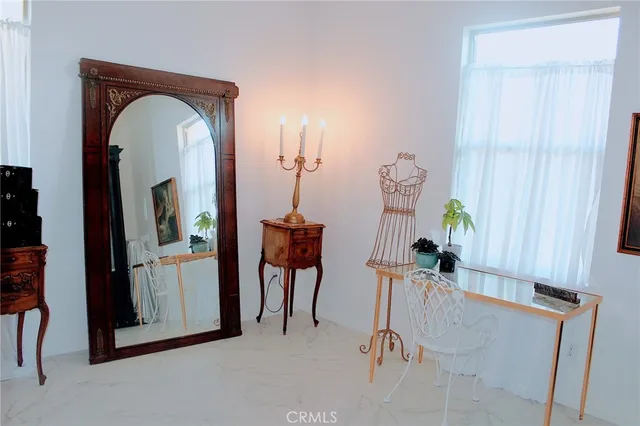 a view of a bathroom with a sink and a mirror