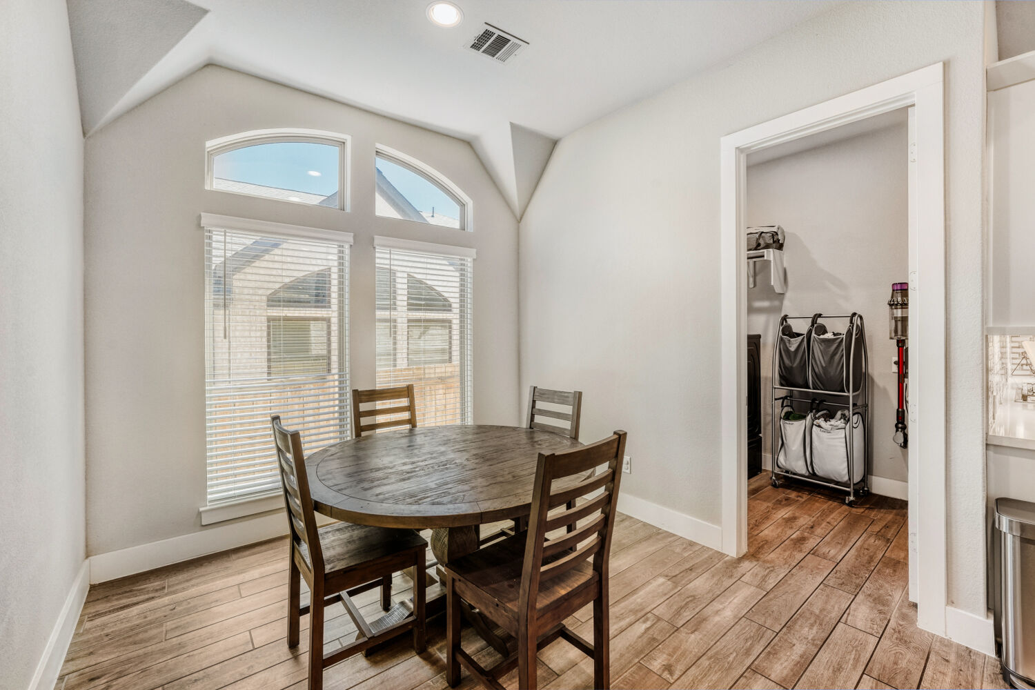 505 Trout River Road Kyle, TX 78640 - Photo 11 of 29 Dining room featuring light wood finished floors, vaulted ceiling, and recessed lighting