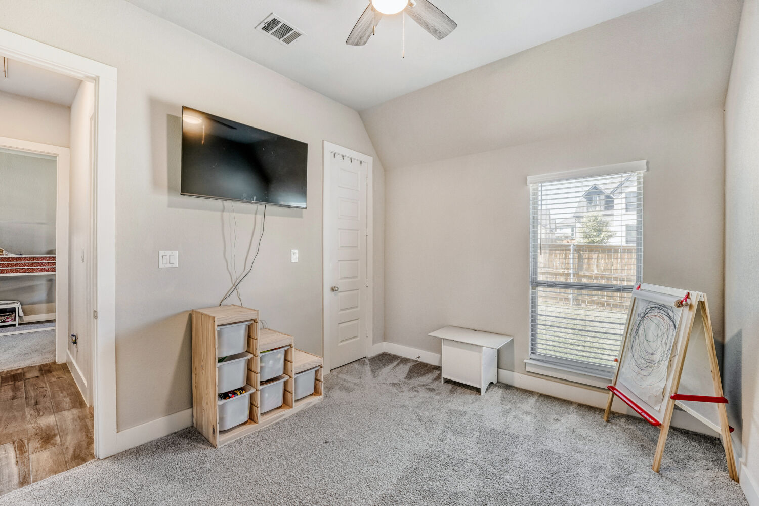 505 Trout River Road Kyle, TX 78640 - Photo 18 of 29 Sitting room featuring ceiling fan, light colored carpet, and vaulted ceiling