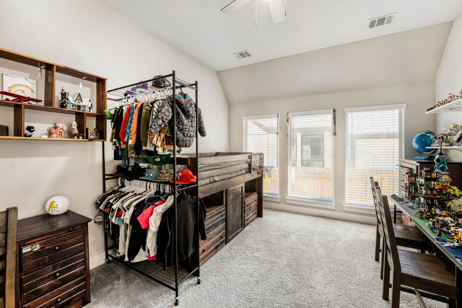 505 Trout River Road Kyle, TX 78640 - Photo 21 of 29 Walk in closet featuring lofted ceiling, light carpet, and ceiling fan